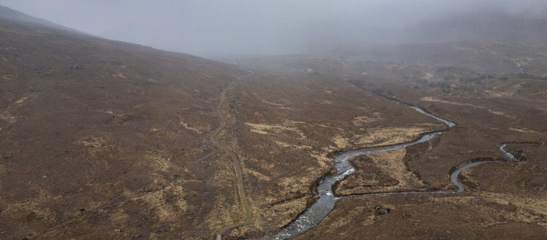 Aerial view of a Highland river valley and hydro access track