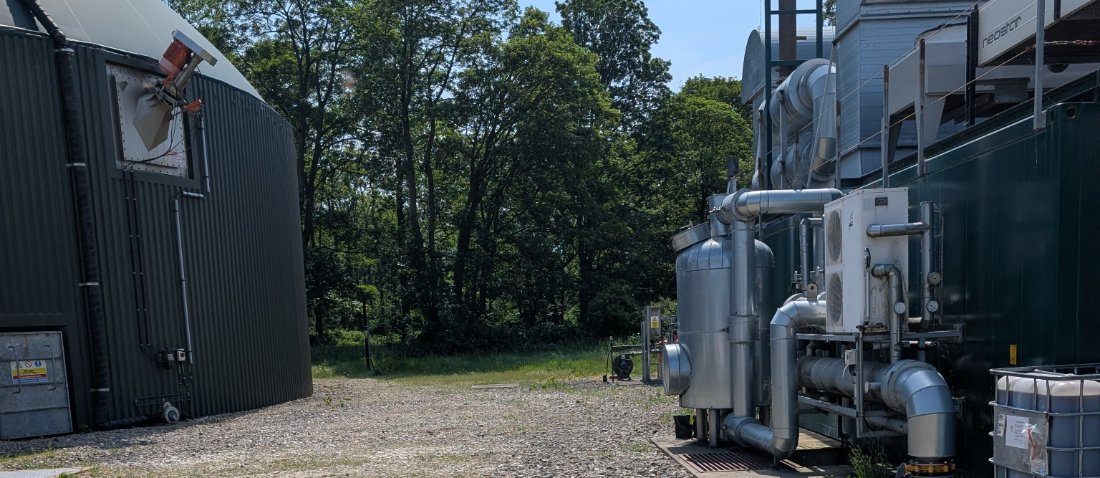 Anaerobic digestion tank and CHP plant on a farm site